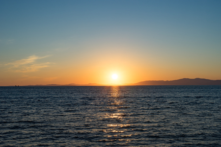 Seascape with beautiful sunset and sunset on the horizon.の写真素材