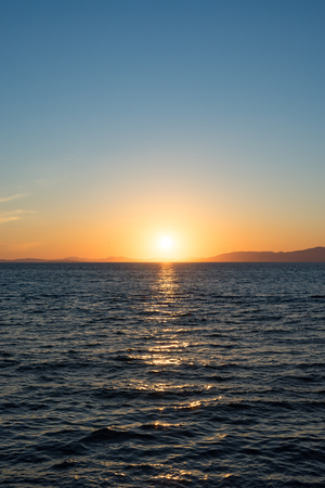 Seascape with beautiful sunset and sunset on the horizon.の写真素材