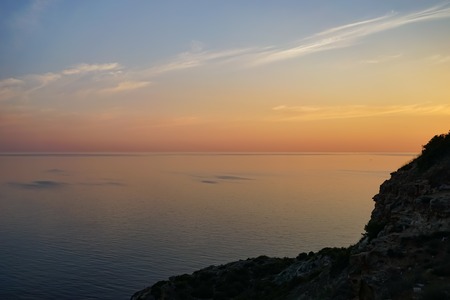 Amazing sunset over the sea and coastline.の写真素材