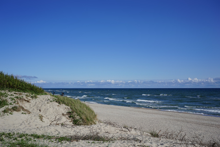 Sea landscape of the Baltic sea with coastal sand dunes of the Curonian spit.の写真素材