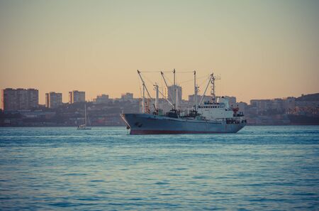 Vladivostok, Russia-September 16, 2018: Seascape with ships on the background of the city.のeditorial素材