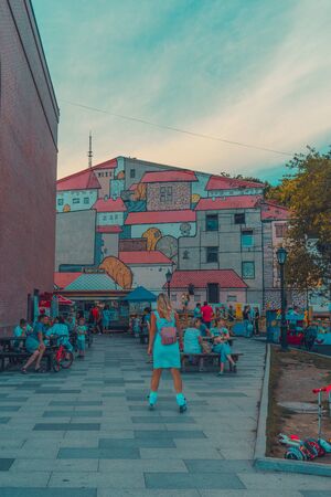 Vladivostok, Russia-August 11, 2018: Landscape of the modern city with people on the background of attractions.のeditorial素材