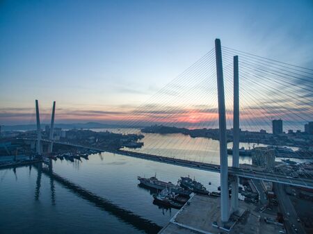 Vladivostok, Russia-January 12, 2019: Aerial view of the Golden bridge against the evening sunset.のeditorial素材