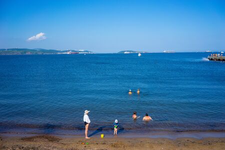 Vladivostok, Russia-August 19, 2018: Seascape with the coastline of the beach in the campus on the island of Russian.のeditorial素材