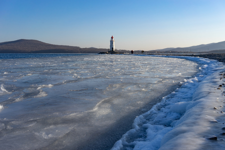 Seascape overlooking The Tokarev lighthouse against the blue sky.の写真素材