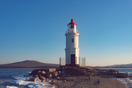 Seascape overlooking The Tokarev lighthouse against the blue sky.の写真素材