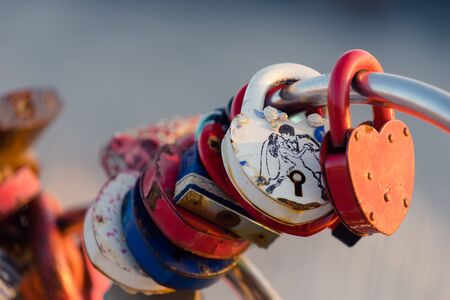 Vladivostok, Russia-January 29, 2019: Background with lots of colorful locks on the bridge railing.のeditorial素材