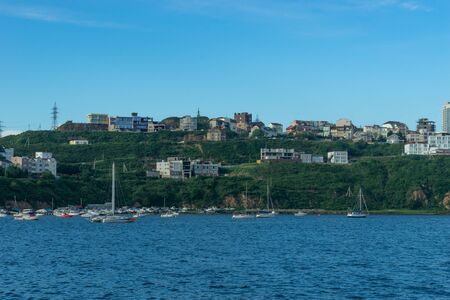 Vladivostok, Primorsky Krai-August 26, 2018: Seascape with ships on the background of the coastline of the city.のeditorial素材