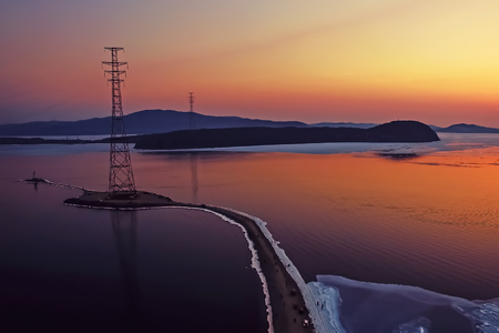 Aerial view of the sea landscape with sunset and ice floes on the seaの写真素材