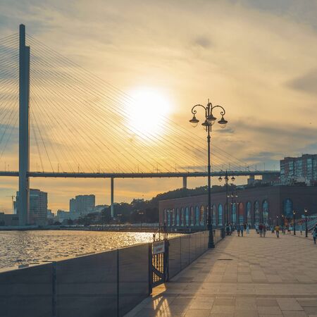 Vladivostok, Russia-August 11, 2018: Modern bridge on the background of the urban landscape and the sea.のeditorial素材