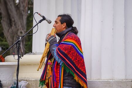 Sevastopol, Crimea-March 18, 2015: A man in national dress playing a wind instrumentのeditorial素材