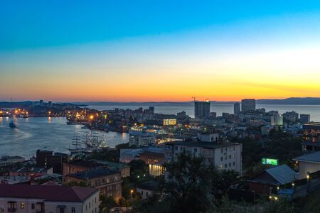 Vladivostok, Primorsky Krai-September 9, 2018: Urban landscape in the evening light at sunsetのeditorial素材