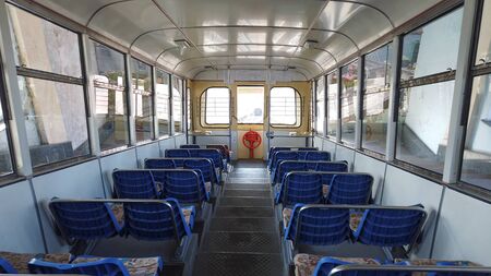 Vladivostok, Primorsky Krai-March 29, 2019: A cable car with blue seats without people.のeditorial素材