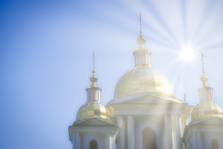 Glittering domes of a Christian Church on the background of blue cloudless skyの写真素材