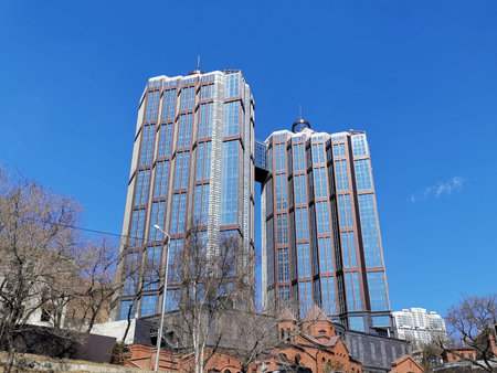 Vladivostok, Primorsky Krai - April 10, 2019: Urban landscape with views of modern high-rise buildings and the Armenian Church.のeditorial素材