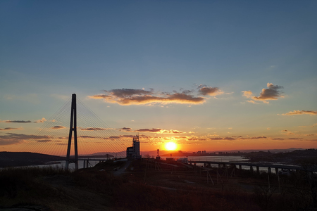 Silhouette of the Russian bridge at sunset. Vladivostok, Primorsky Krai.の写真素材
