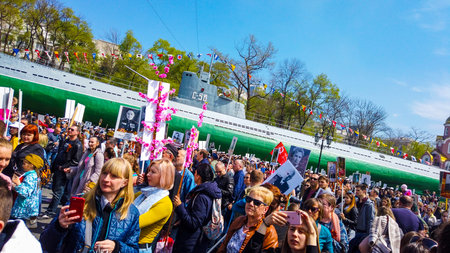 Vladivostok, Primorsky Krai - may 9, 2019: Ship quay, a lot of people celebrate the Victory Day.