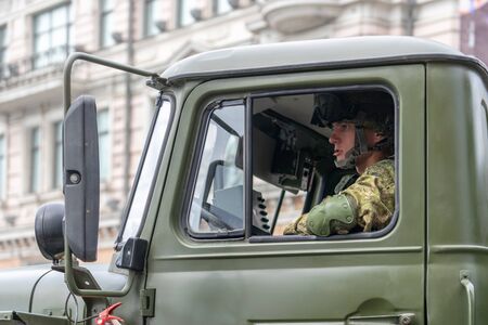 Vladivostok, Primorsky Krai - may 9, 2019: The cockpit of a military car with a driver. Festive parade on Victory Day.のeditorial素材