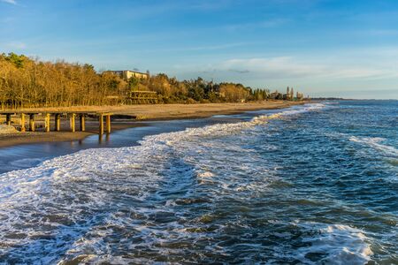 Waves splash on the shoreの写真素材