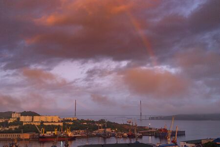 Rainbow in the pink sky over the Russian bridge. Vladivostok, Russiaの写真素材