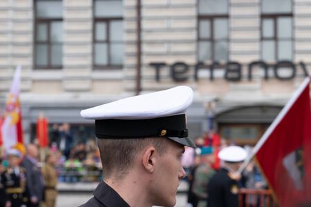 Vladivostok, Primorsky Krai - may 9, 2019: Portrait of a man in a sea uniform on a blurred street backgroundのeditorial素材