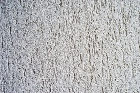 Abstract yellow wall background with scuffs and cracksの写真素材