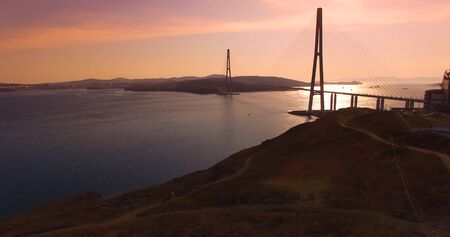 Air review of the Russian bridge on the background of the sea landscape.の写真素材