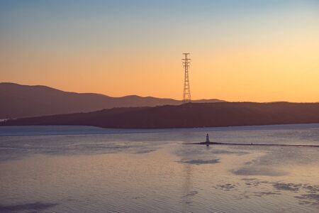 Seascape with a beautiful sunset over the Tokarev lighthouse. Vladivostok, Russiaの写真素材