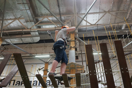 Vladivostok, Primorsky Krai - July 22, 2019: Rope Park with children passing obstacles.