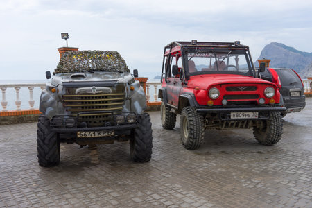 Sudak, Russia-may 20, 2018: Cars SUVs on the waterfront of the city.