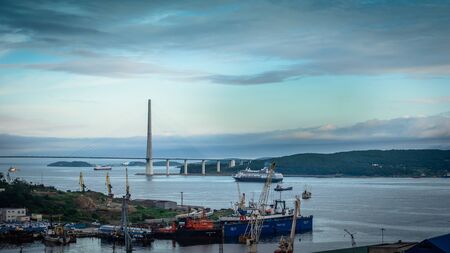 Vladivostok, Primorsky region - August 8, 2019: Sea landscape with a view of the Russian ships and the bridge.の写真素材