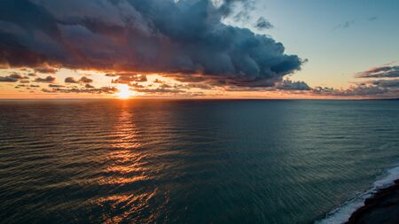 Aerial view of the sea landscape with a beautiful sunset. Dramatic sky.の写真素材