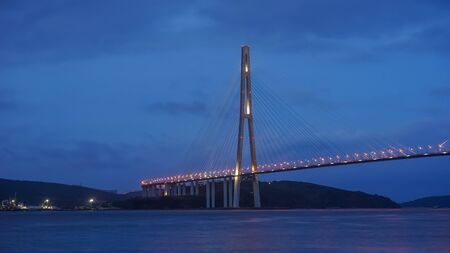 Vladivostok, Russian bridge. Night photos on a long exposure. Beautiful reflection on the surface of the sea.の写真素材
