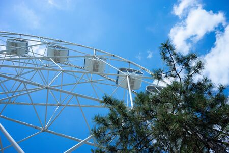 Beautiful and modern Ferris wheel on blue sky background. Evpatoria, Crimeaの写真素材