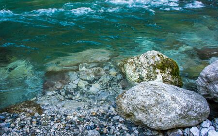 Rocky shore of a mountain river with clear water. Beauty of natureの写真素材