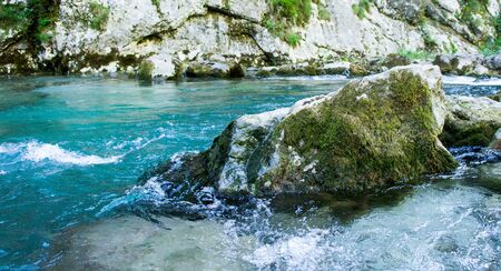 Rocky shore of a mountain river with clear water. Beauty of natureの写真素材