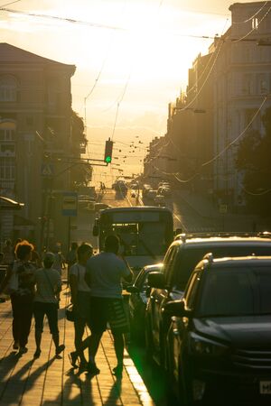 Vladivostok, Russia - August 11, 2018: Cityscape in the Golden light of sunset. Street with people and cars.のeditorial素材