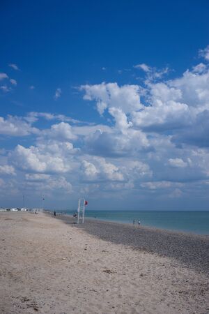 Evpatoria, Crimea - may 24, 2018: Panorama of the coastline with a beautiful white beach. People sunbathe and swim on a Sunny day.のeditorial素材