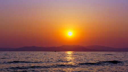 Seascape with beautiful sunset over the sea.の写真素材