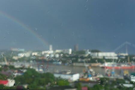 Vladivostok, Primorsky Krai-August 28, 2019: Magnificent cityscape overlooking Diomid Bay with a beautiful double rainbow in the sky.のeditorial素材