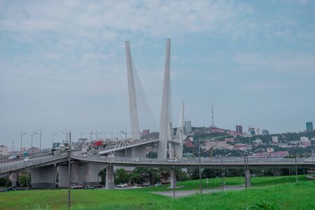 Vladivostok, Primorsky Krai-September 3, 2019: Panorama of the urban landscape overlooking the Golden bridge and highway.のeditorial素材