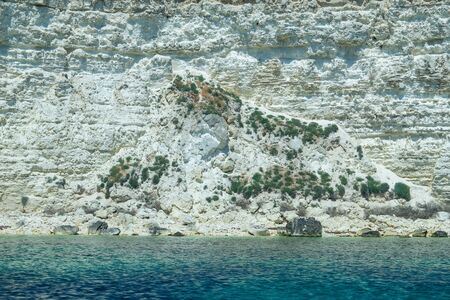 Beautiful view of us we are with the rocky shore of the black sea and the green-blue water on a Sunny summer cloudless day. Tarkhankut national reserve. Republic Of Crimeaの写真素材