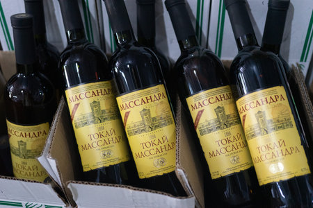 Yalta, Crimea-may 30, 2018: Massandra winery Warehouse with wine bottles and price tags.のeditorial素材