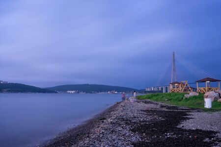 Seascape with coastline in blue hour. Vladivostok, Russiaの写真素材