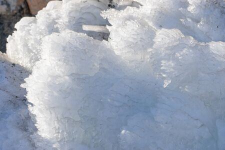 Natural background with icicles on a stone rock.の写真素材