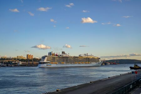 Vladivostok, Primorsky Krai-September 18, 2019: seascape with a beautiful cruise ship on the background of the city.のeditorial素材