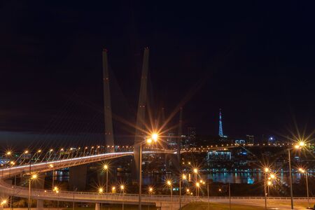Golden bridge against the night skyの写真素材