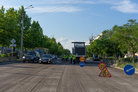 Yevpatoriya, Crimea - may 24,2018: cityscape with a view of the road repair.のeditorial素材