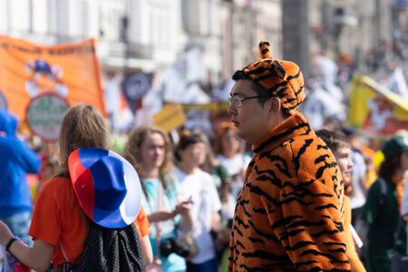 Vladivostok, Primorsky Krai-September 29, 2019: City square with people and cars during Tiger Day celebrations. The carnival is dedicated to the protection of ecology and the far Eastern tigers.のeditorial素材