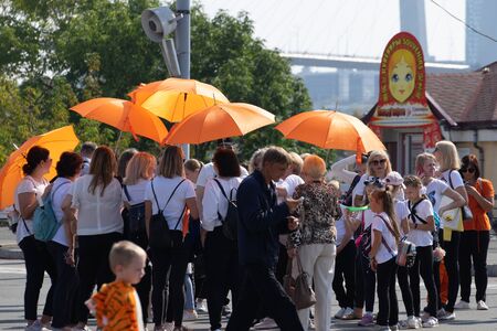Vladivostok, Primorsky Krai-September 29, 2019: City square with people and cars during Tiger Day celebrations. The carnival is dedicated to the protection of ecology and the far Eastern tigers.のeditorial素材